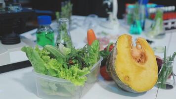 A table with vegetables and a pumpkin video