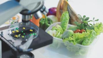 A microscope is looking at a container of vegetables video