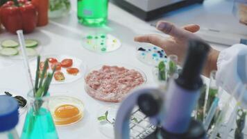 A person in a lab coat is holding a bowl of food video
