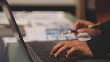 A person typing on a laptop computer video