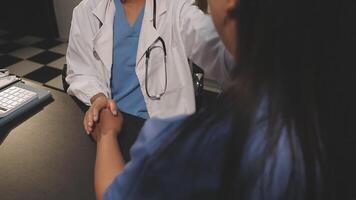 A doctor shaking hands with a patient video