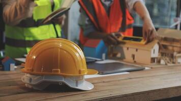 A construction worker is working on a model of a house video
