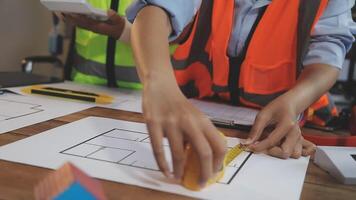 A man and woman working on a construction project video