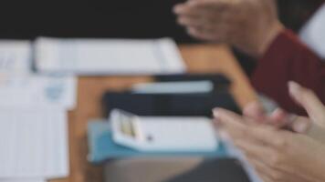 A person clapping at a meeting table video