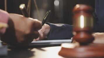 A judge signing a document video