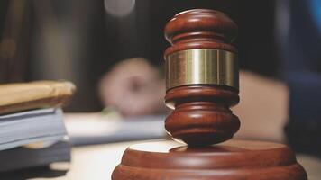 A judge's gavel on a wooden table video