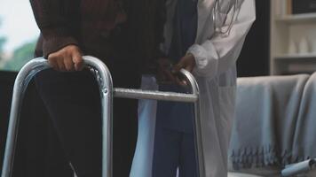 A woman with a walker and a doctor video