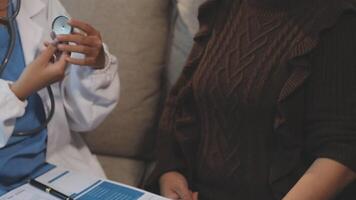 A doctor is talking to a patient video