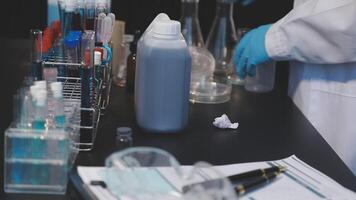 A person in a lab coat is working on a project video