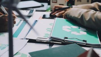 A person is working on a laptop with a recycling symbol on it video