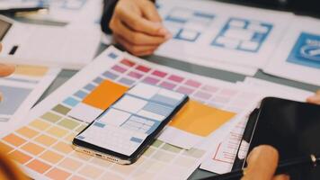 A group of people working on a design project video