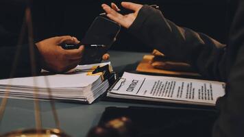 A lawyer signing a document with a client video