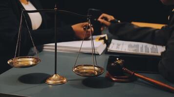 A judge scales a scale with a gavel and a book video