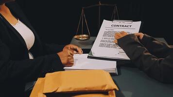 Two people signing a contract on a desk video