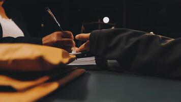A person writing on a piece of paper with a pen video