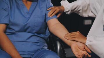 A nurse is holding the hand of a patient video