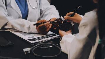 Two doctors examining a patient's eye video