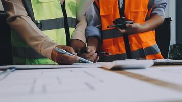 Two construction workers are working on a project video