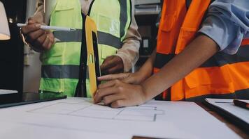 Two people in safety vests working on a project video