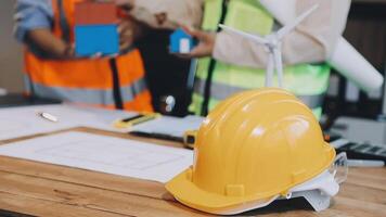 A hard hat and a piece of paper on a table video