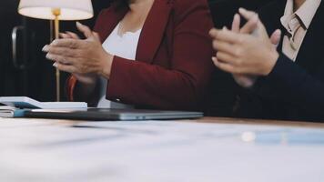 Two business people clapping at a meeting video