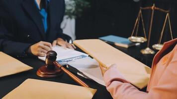 A lawyer and a judge are discussing a case video