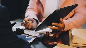 A lawyer and a client at a desk video
