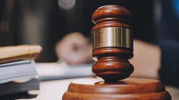 A judge's gavel on a wooden desk video