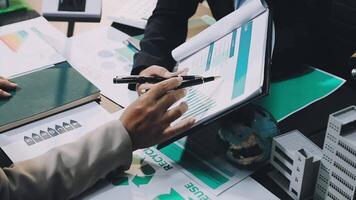 Business people working on a document at a table video