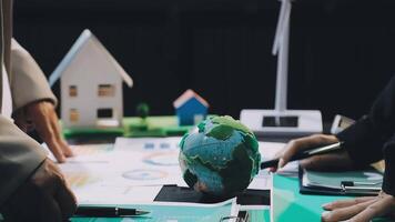 Business people working on a project with a globe video
