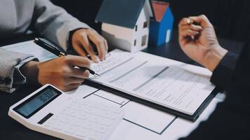 A real estate agent and a client signing a contract video