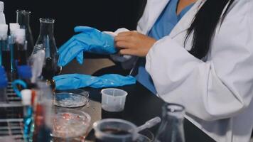 A woman in a lab coat is working on a project video