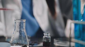 A person in a lab coat is working on a project video