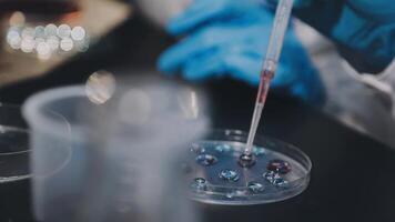 A person in a lab coat is holding a tube video