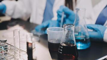 Scientists working in a laboratory with test tubes video