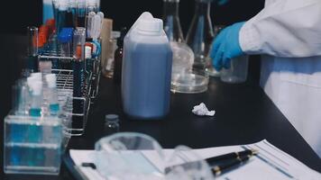 A person in a lab coat is working on a project video