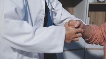 A doctor shaking hands with a patient video