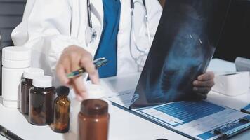 A doctor is looking at a x - ray image on a table video