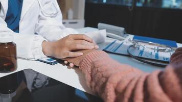 A doctor holding hands with a patient video