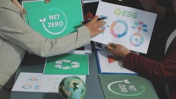 Business people working on net zero paper video