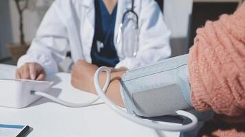 A doctor is checking the blood pressure of a patient video