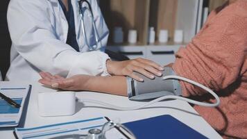 A doctor checking the blood pressure of a patient video
