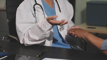 A doctor shaking hands with a patient video