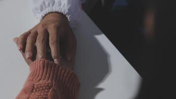 A person holding hands with another person video