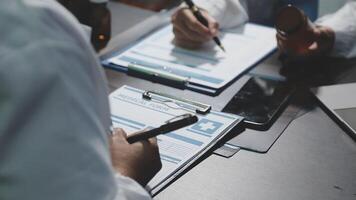 A doctor is writing on a clipboard video