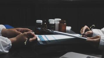 Two doctors are working on a document video