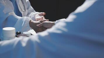 A doctor shaking hands with another person video