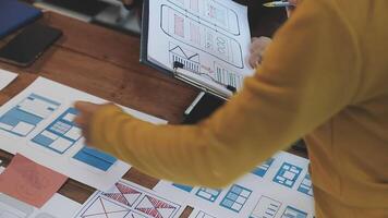 A person is looking at a design on a table video