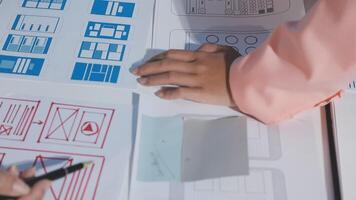 A person is working on a design document with a pen video