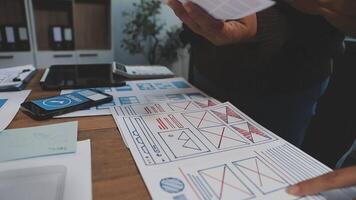 A person is looking at a paper with a design on it video